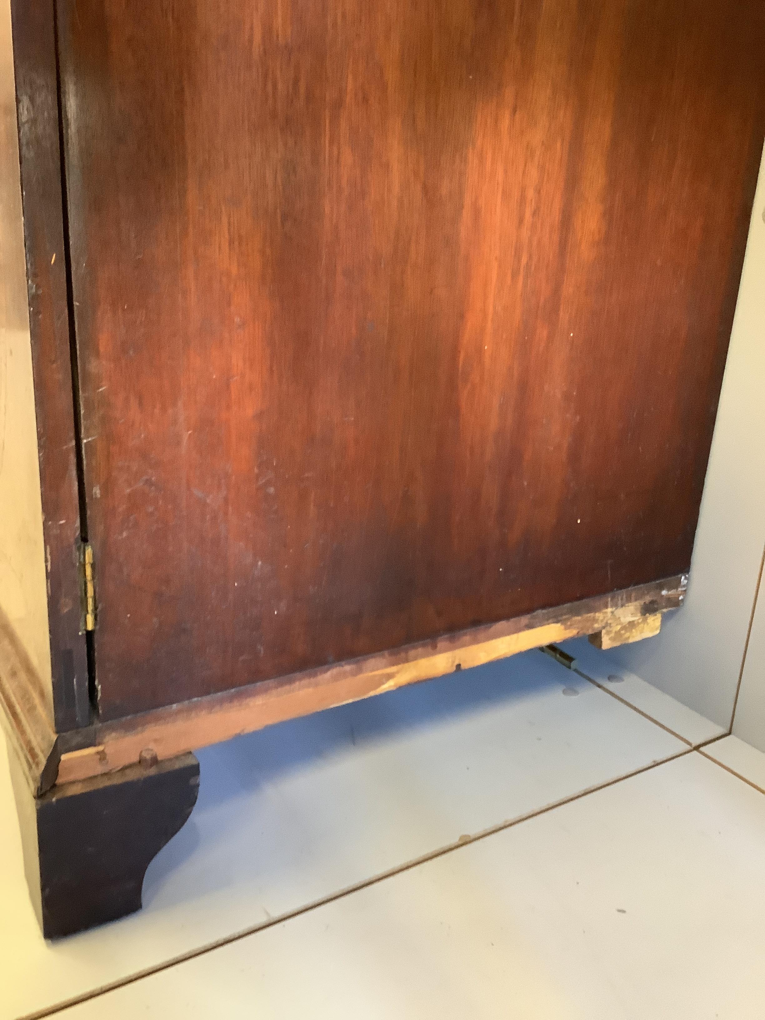 A George III satinwood banded mahogany secretaire bookcase, width 117cm, depth 58cm, height 236cm (a.f.)